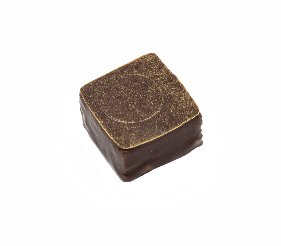 Handgemachte Schnittpraline mit Zitrone und Marzipan - überzogen mit dunkler Schokolade - Max Chocolatier